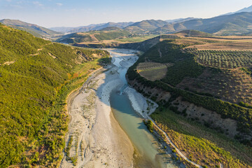 Aerial view of river Osumi by village Mbrakull near Polican in Albania in Summer sunrise