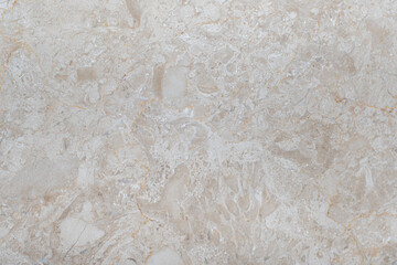 White marble background with real beige spots and patterns. Marble white tiles with beige streaks.