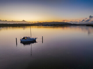 Fototapeta na wymiar Soft and subtle sunrise waterscape over the bay