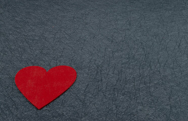 Fototapeta premium Red heart on black textured background. Nice copy space. Valentine's day love card Sweetheart
