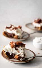 Three slices of chocolate pie and whipped cream