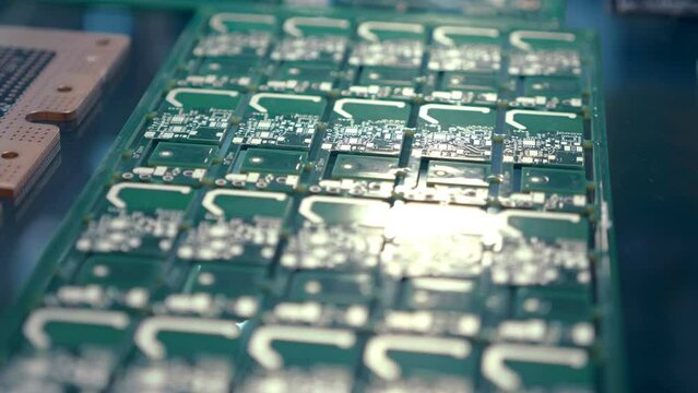 Samples of blank factory printed circuit boards (PCBA) as exhibition samples. Shot in motion. Closeup
