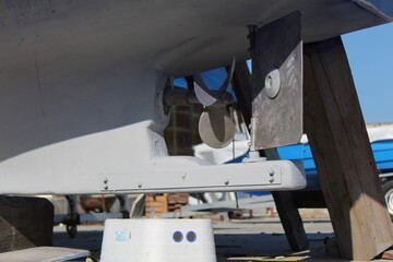 The propeller of a blue fishing boat