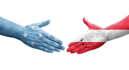 Handshake between Micronesia and Austria flags painted on hands, isolated transparent image.