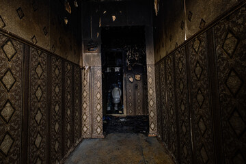 Fototapeta na wymiar Burnt apartment house interior. Consequences of fire