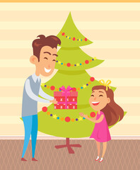 Father gives present to daughter. Happy parent and child celebrate at home on background of christmas tree. Dad presents gift to child for new year. Family spends time together on christmas eve