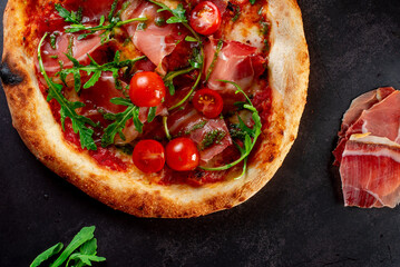 pizza with salami and tomatoes