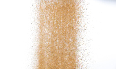 Sand flying explosion, Golden sand wave explode. Abstract sands cloud fly. Yellow colored sand splash throwing in Air. White background Isolated high speed shutter, throwing freeze stop motion