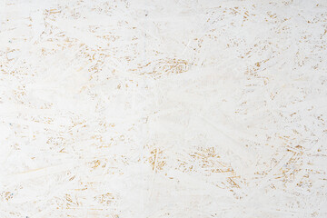 Oriented strand board OSB painted white. Background of rough surface made of compressed sawdust. Construction backdrop