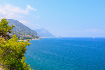 Fototapeta premium Very beautiful rocky Turkish Mediterranean coast in Beldibi district of Kemer, Antalya province in Turkey