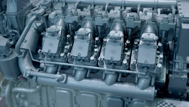 New gray color eight cylinder diesel truck engine or diesel generator. Shot in motion. Closeup