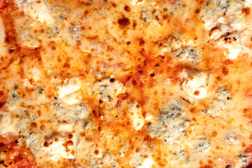 Obraz na płótnie Canvas Quatro formaggi four cheese pizza detail texture bg