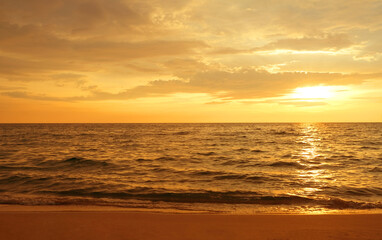 Silhouette Light of sunset on the beach. Aerial view sightseeing sea at koh kood island in thailand beach and panning the sunset sky with clouds.