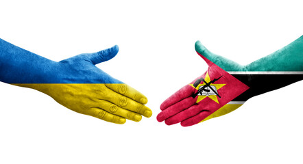 Handshake between Mozambique and Ukraine flags painted on hands, isolated transparent image.