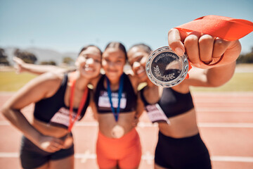 Medal, winner team and athlete women, competition and success at sports stadium, arena and running...