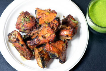image of roasted chicken cooked in coal oven