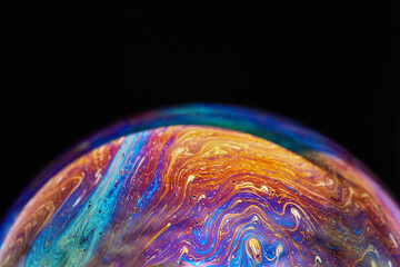 Virtual reality space with abstract multicolor psychedelic planet. Closeup Soap bubble like an...