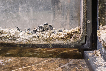 Coals in modern fireplace an extinct fire. Coal and ash in a burnt fire