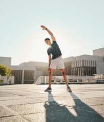 Fototapeta na wymiar Fitness, man and stretching arm in the city for warm up exercise, training or cardio workout in the outdoors. Active male in morning stretch for sports activity, performance or exercising in the town