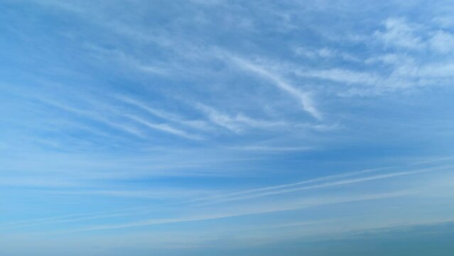 Daylight exotic horizon in tropical summer sunlight. Beautiful sunny blue sky background with tiny cirrus. Timelapse.