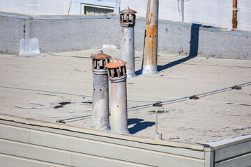 Exhaust combustion vents on flat roof