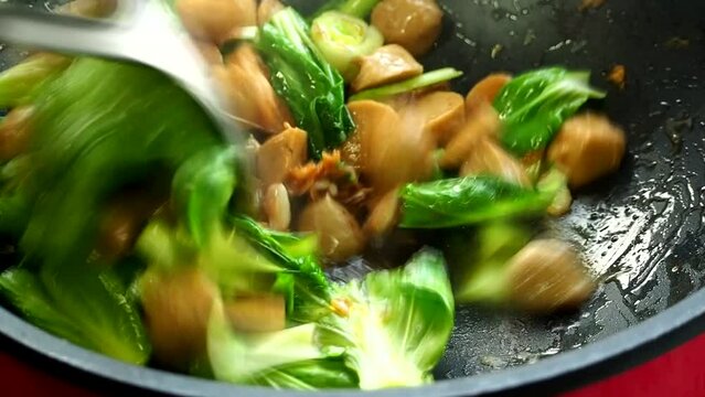 Frying vegetables with meat ball  in pan , Thai famous food