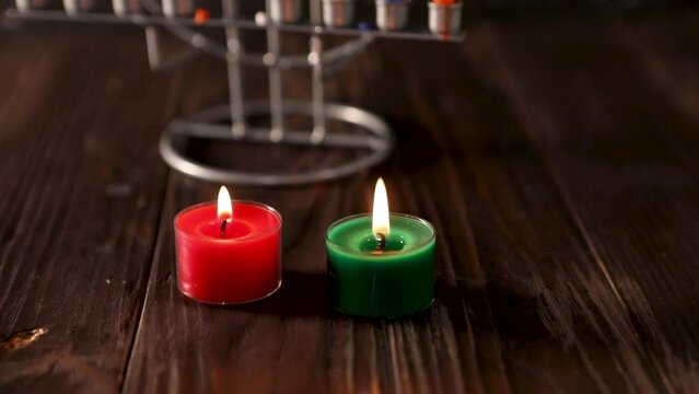 Two Burning Wax Candles And Play With Light