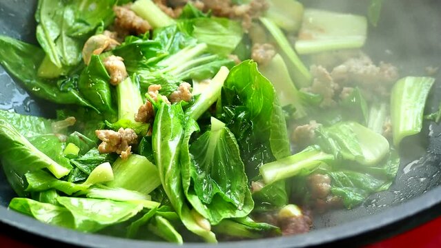 Frying vegetables with minced pork  in pan , Thai famous food