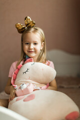 beautiful girl with unicorn in her children's room