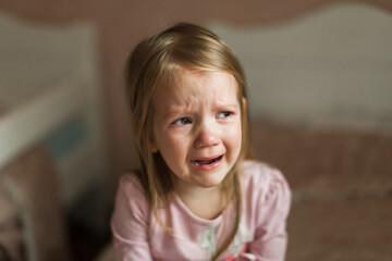 a little girl patches in her children's room. bitter tears