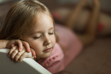 little girl sleeping on her bed in the children's room
