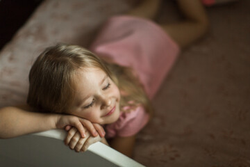 little girl sleeping on her bed in the children's room
