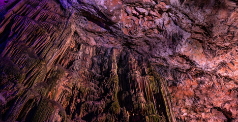 Saint Michael's Cave with colorful lights. Natural Rock Formation. Gibraltar, UK. Nature Background