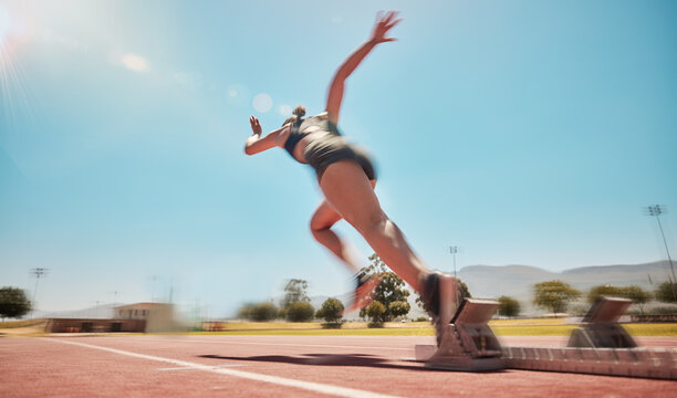 Speed, track start and woman running for marathon race workout, fitness or exercise for leg power action. Health commitment, blue sky flare and fast sports girl, athlete or cardio runner training