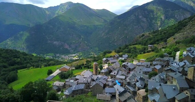 Aerial view over ancient village of Durro in Boi valley amidst huge mountains of Pyrenees, Spain.