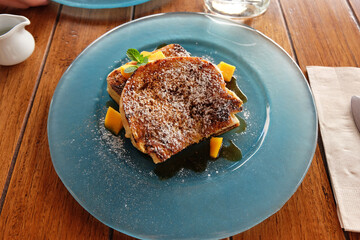 Close up Cinnamon French toast with slices of mango
