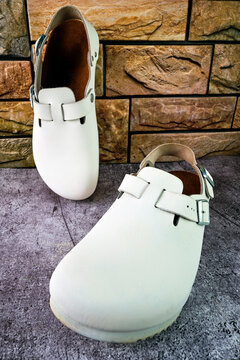 Pair of white genuine leather clogs