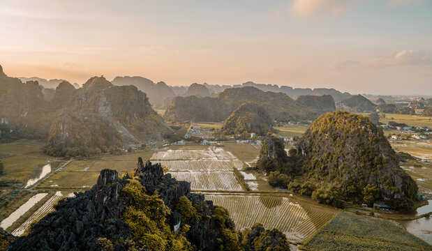 Aerial sunset view of landscapes and lotus fields in Ninh Binh, Vietnam