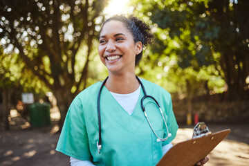 Woman, nurse and smile with clipboard in the park for healthcare, medical or consultation and...