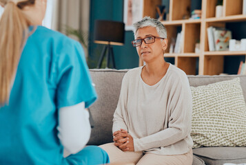 Nurse, senior woman and consultation on sofa in home for health check up or examination....