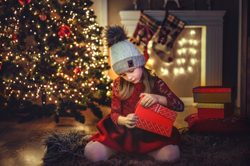 child with christmas presents