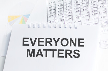 EVERYONE MATTERS text on notepad the table, business