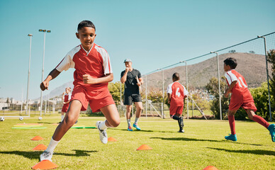 Soccer, children and training or practice for sports competition or game on soccer field for...