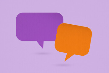 orange and violet speech bubble grunge paper cut on grunge background. Conceptual image about communication and social media, customer feedback