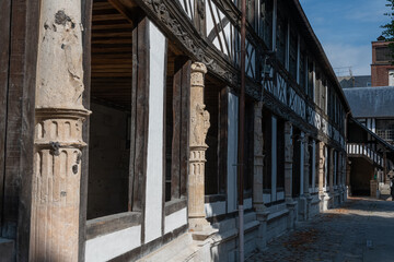 Aitre St. Maclou - Rouen , France: The Atrium of San Maclovio, or Court of San Maclovio, French Aitre Saint-Maclou is an old cemetery-ossuary where plague victims were buried. 