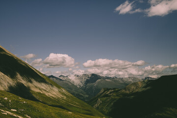 a landscape in the mountains with some clouds