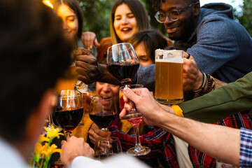 Group of young friends laughing out loud outdoor – group portrait of multi-ethnic boys and girls having fun – young people enjoy party