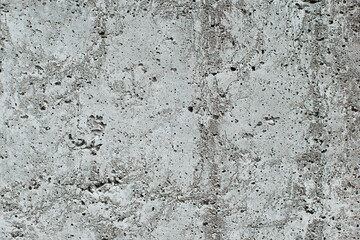 Top view of black, white, gray grunge textured rough stone background with cracks, scratches and stains.