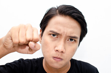 Headshot of asian man with angry, mad, depressive and furious face expression looking for fight isolated over white