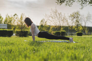 Healthy woman yoga lifestyle balanced practicing meditate and zen energy exercise sport yoga outdoors